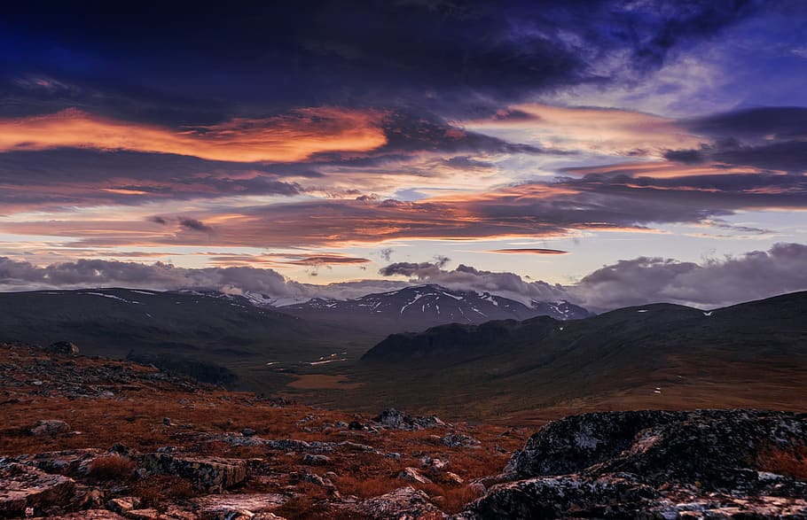 sunset, sky, clouds, field, mountains, hills, rocks, landscape HD wallpaper