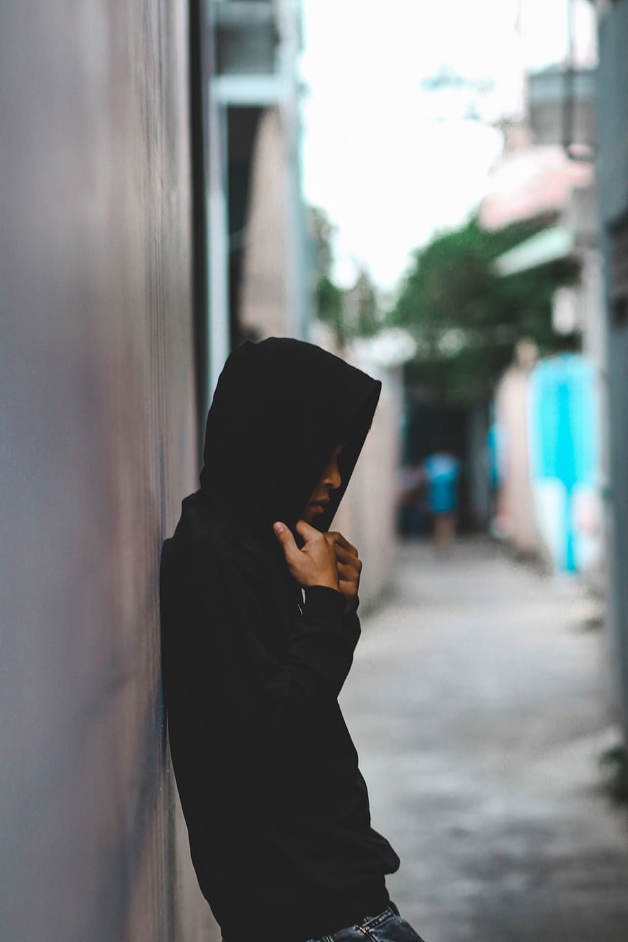 Person Leaning On Wall Wearing Black Hooded Jacket, man, street HD wallpaper