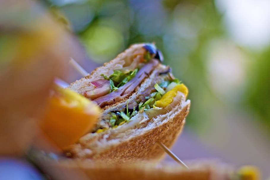 food photography of clubhouse sandwich, bread, burger, pita, person