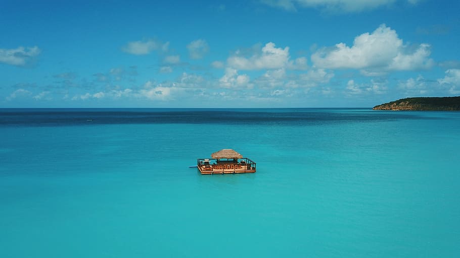 floating house in the middle of sea at daytime, transportation