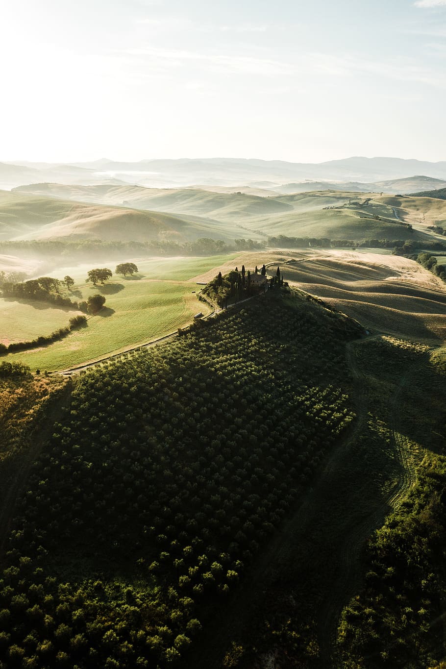 aerial photography of green fields, hill, tuscany, wide landscape