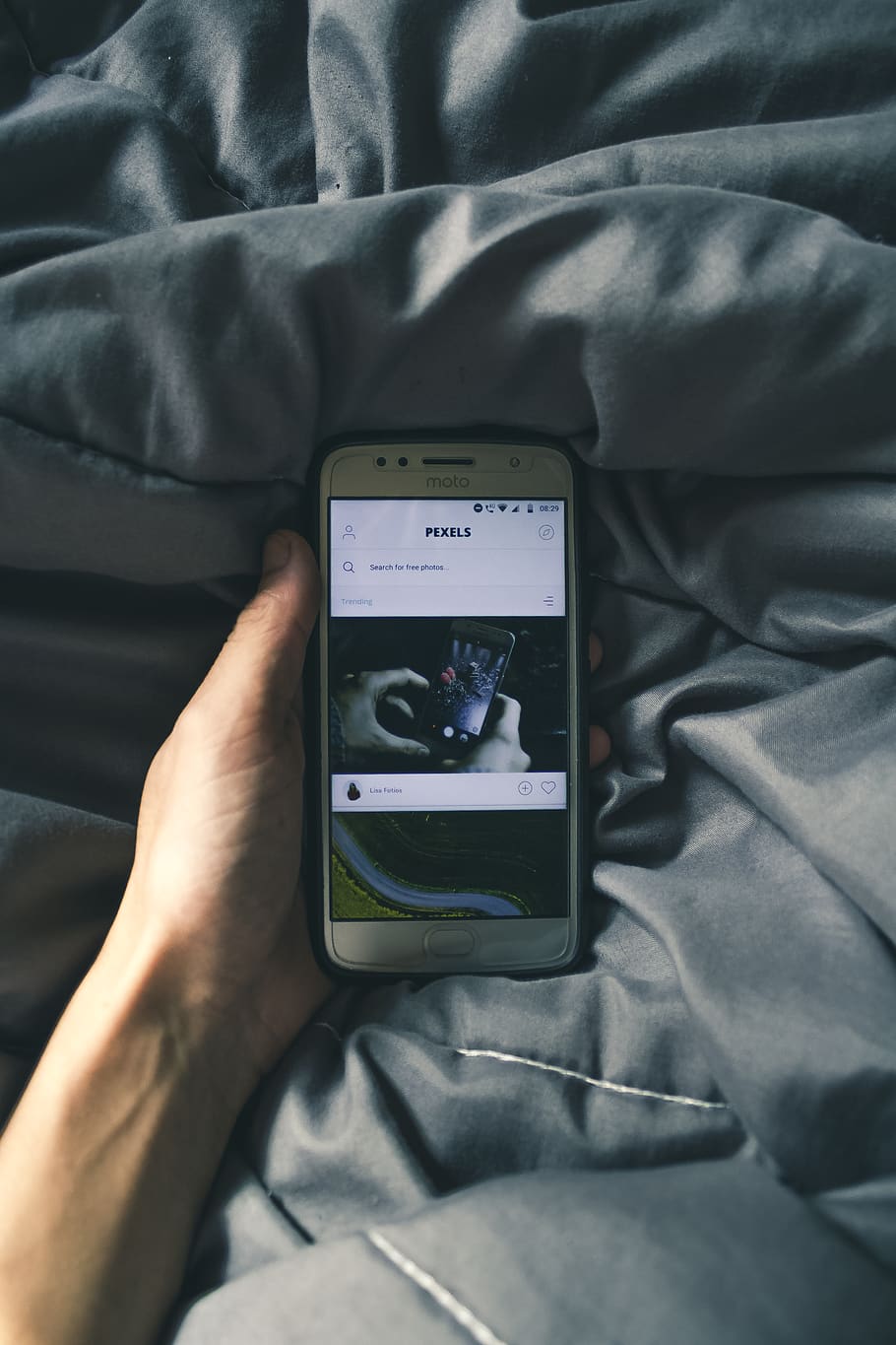 Photo of Person Holding Phone, cellphone, comforter, device, electronic HD wallpaper