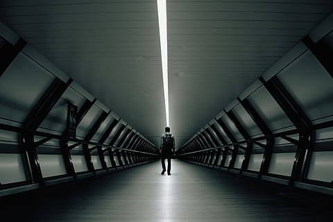 Man Standing Inside Building, architecture, backpack, black and white HD wallpaper