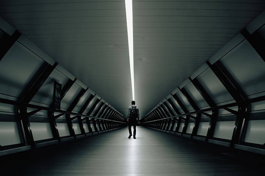 Man Standing Inside Building, architecture, backpack, black and white HD wallpaper