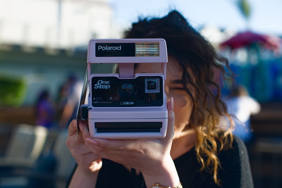 camera, polaroid, bokeh, technology, focus on foreground, one person
