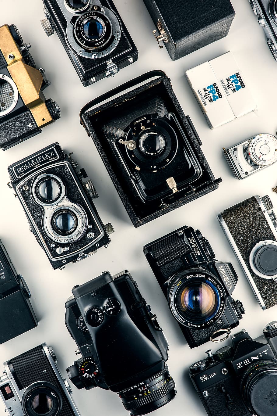 black cameras on white surface, electronics, digital camera, wristwatch HD wallpaper