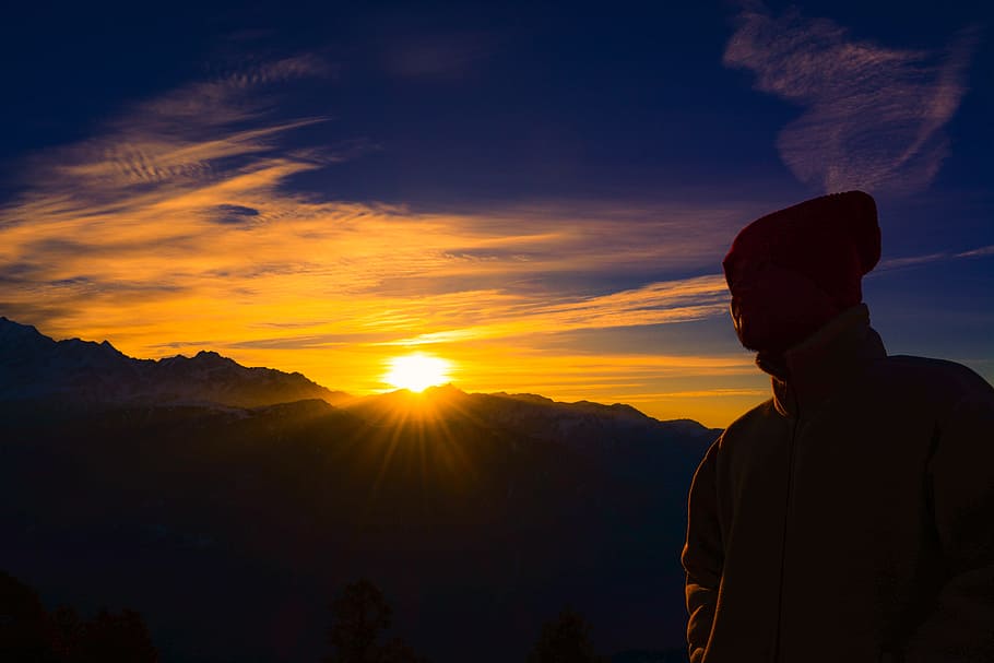 Silhouette of Person Near Mountain during Golden Hour, backlit HD wallpaper