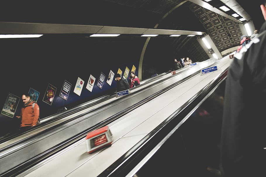 man standing on escalator, underground, tube station, underground station HD wallpaper
