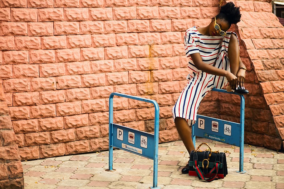Woman With Striped Romper Sitting on Blue Metal, bag, brick texture HD wallpaper