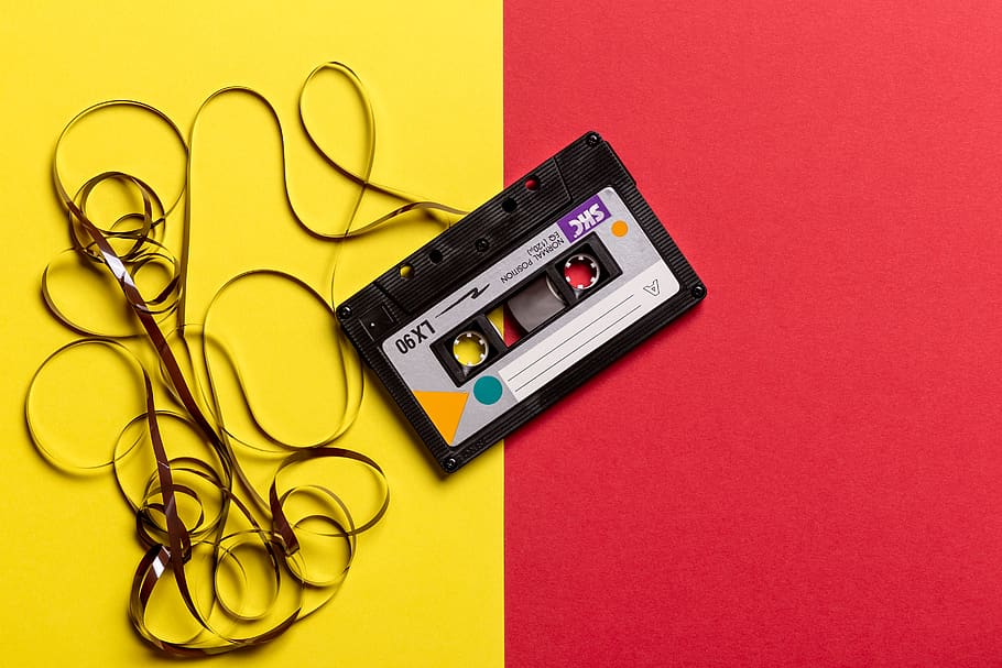 Black Cassette Tape on Top of Red and Yellow Surface, audio, color, HD wallpaper