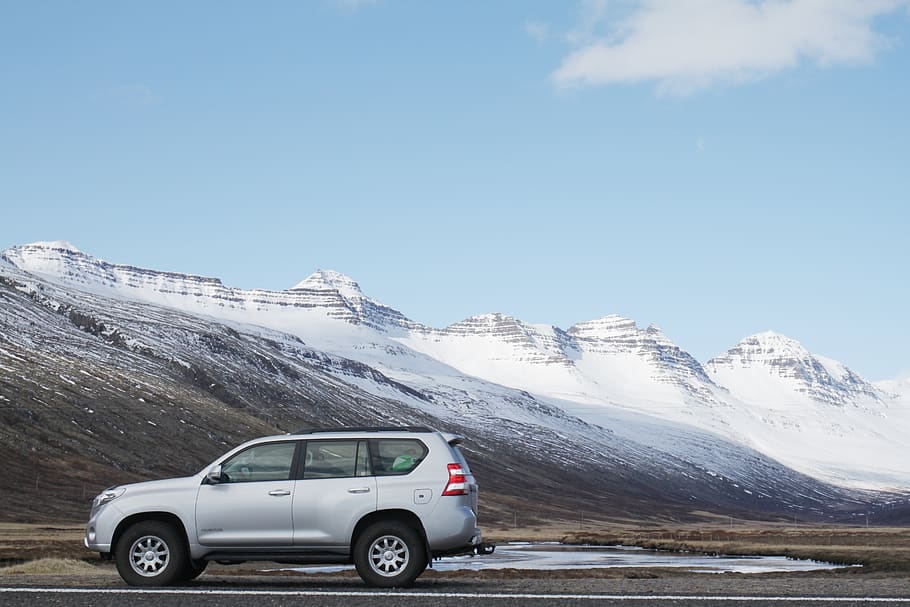 Gray Sports Utility Vehicle on Road Near Snow Covered Mountain HD wallpaper