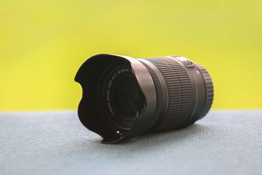 black DSLR camera lens on gray surface, electronics, glass, yellow HD wallpaper