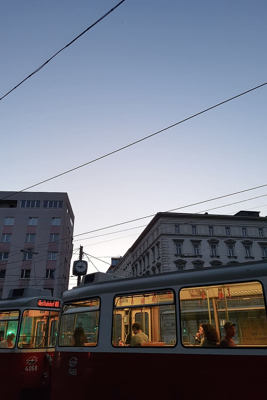 red turned-on train, street, tram, commute, rushhour, evening HD wallpaper