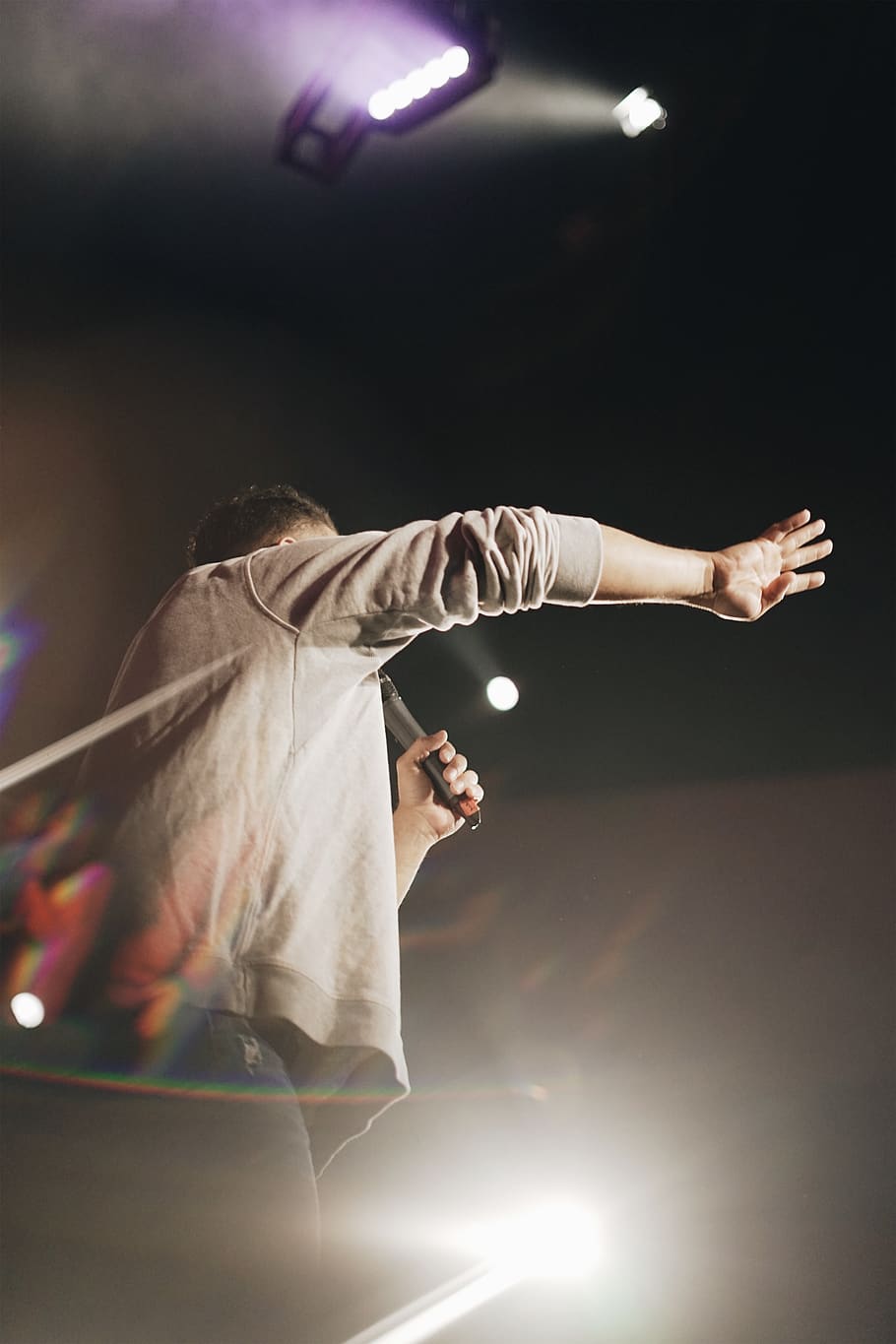 man holding microphone, illuminated, arts culture and entertainment HD wallpaper