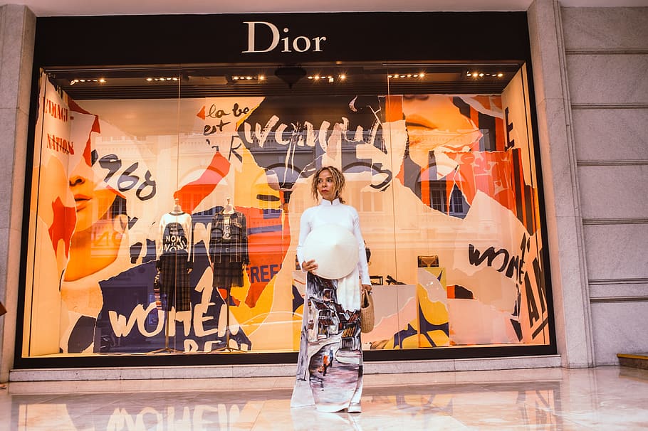 Woman Standing in Front of Dior Store Front, ao dai, art, beautiful