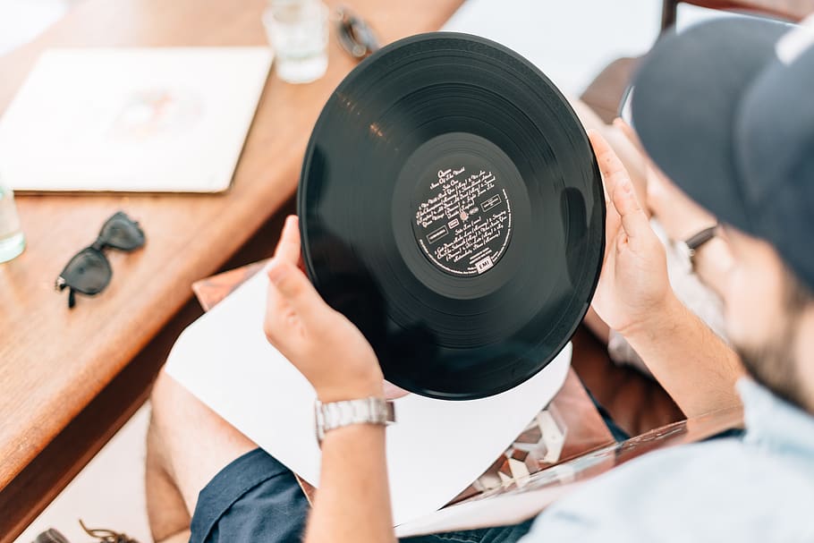 man holding vinyl record, men, adult, real people, human body part HD wallpaper
