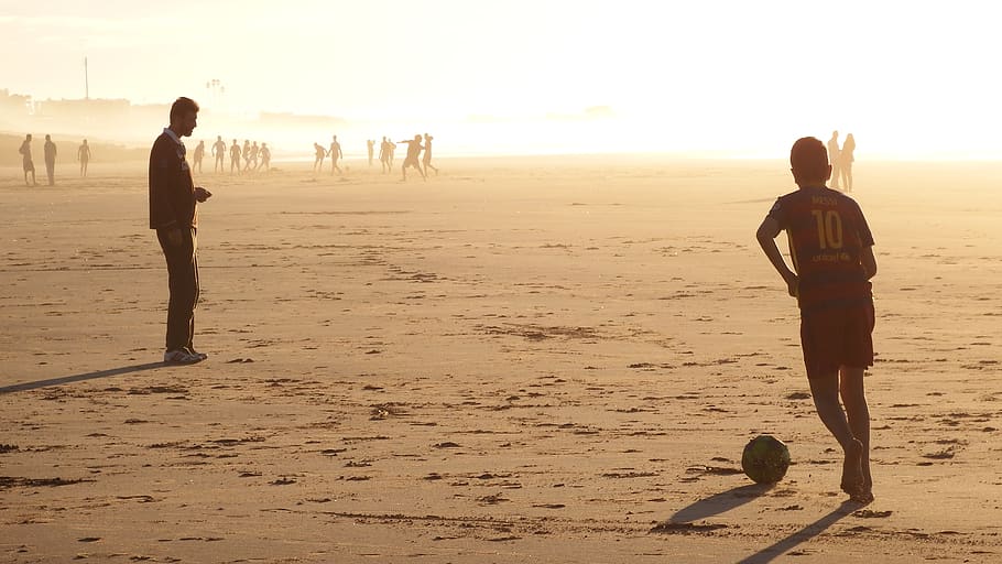 man playing soccer, person, human, nature, outdoors, people, beach HD wallpaper