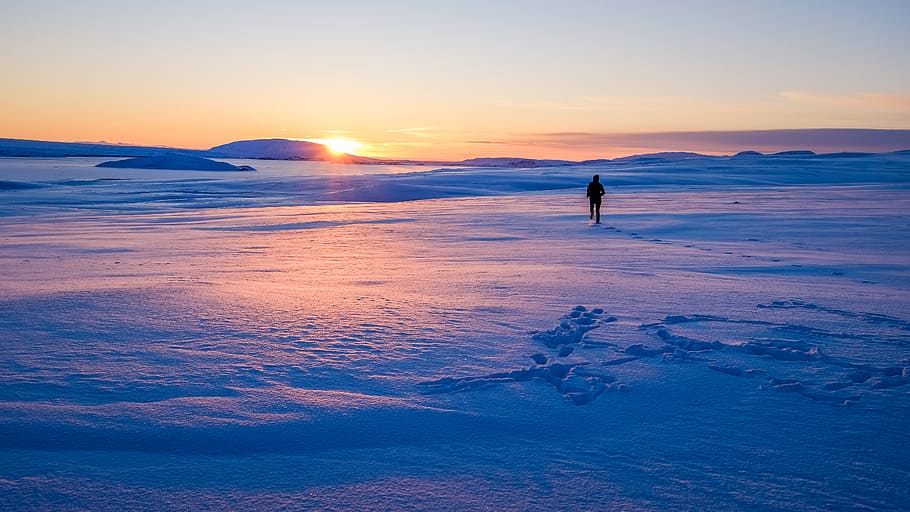 man walking on snowfield during sun rise, footsteps, person, winter HD wallpaper