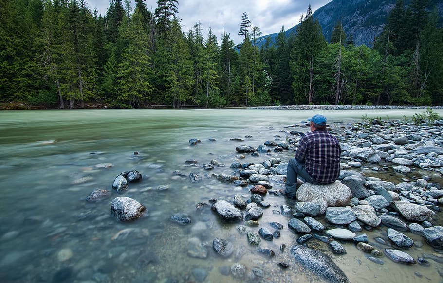 Person Sitting on Stone Near Body of Water, canada, daylight HD wallpaper