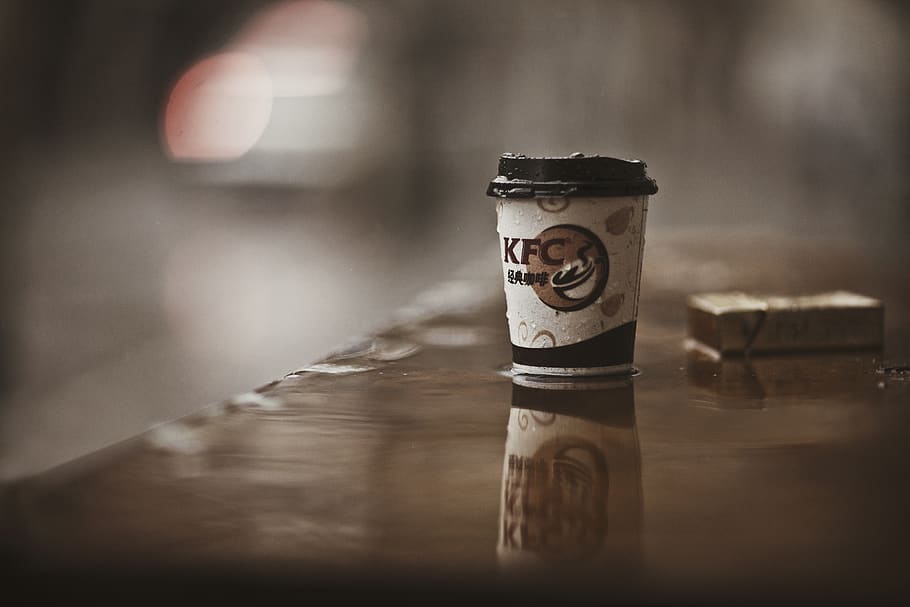 selective focus photography of KFC paper cup on brown wooden surface, HD wallpaper