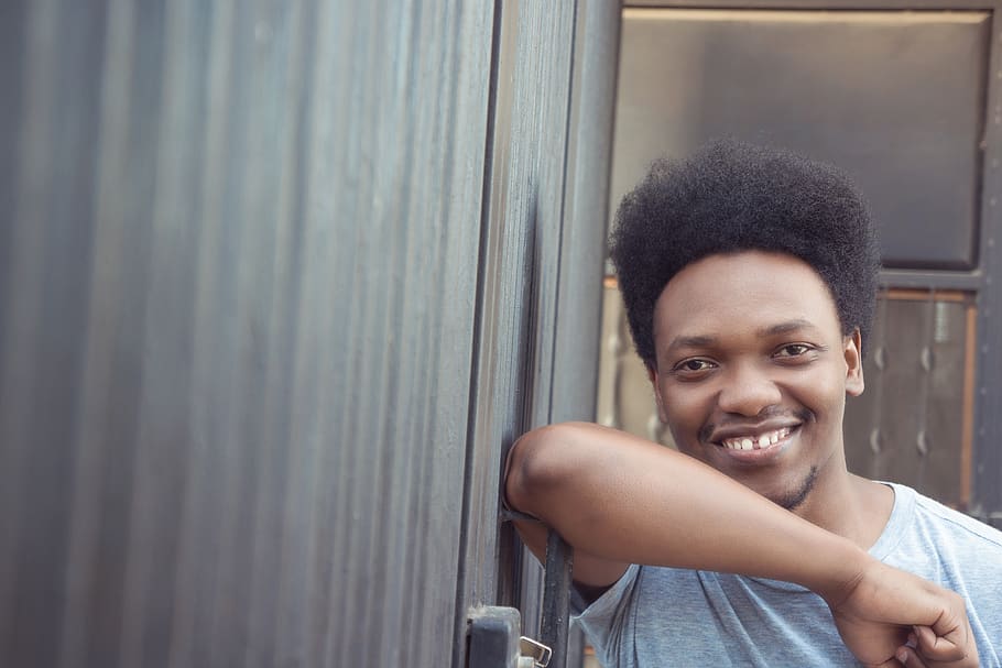 man leaning beside door, smiling, portrait, happiness, looking at camera HD wallpaper