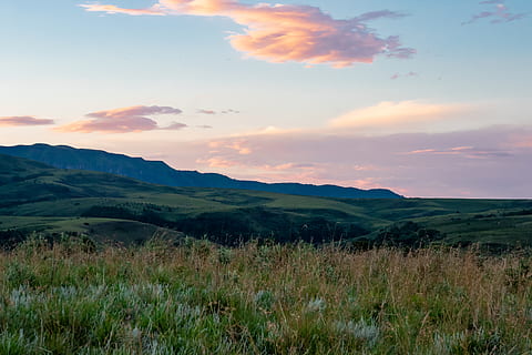 Grass Field Near Hill Under Cloudy Sky, background, backlit, clouds HD wallpaper