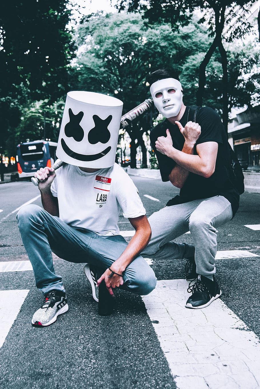 Photo of Two Men in Masks Squat Posing, fun, masked, pedestrian crossing