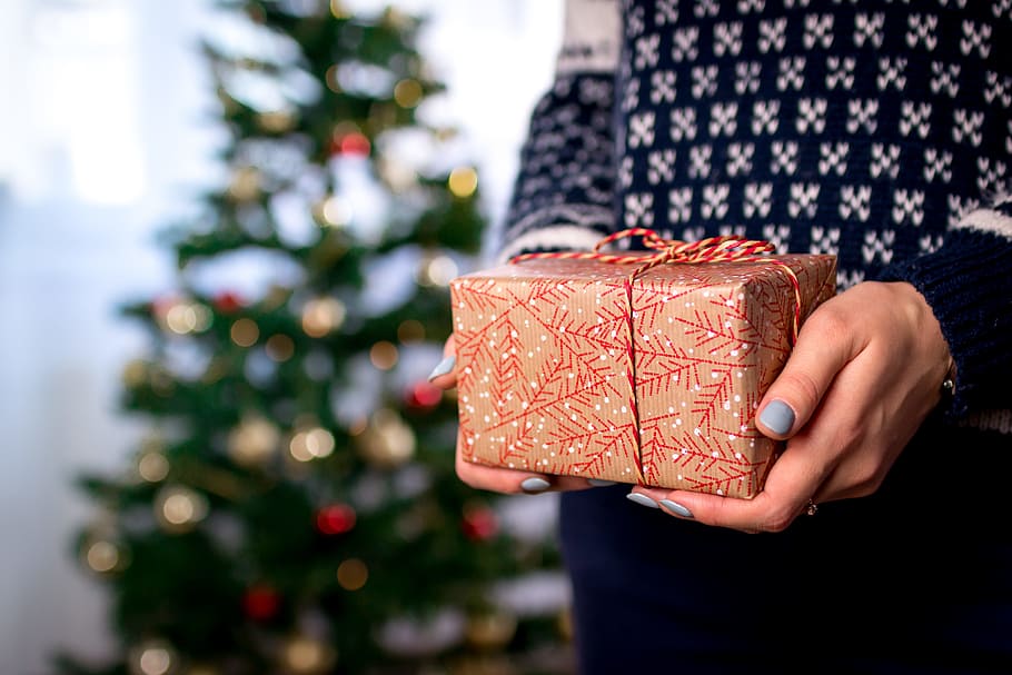 Woman’s hands hold christmas gift box. Merry Christmas, celebration HD wallpaper