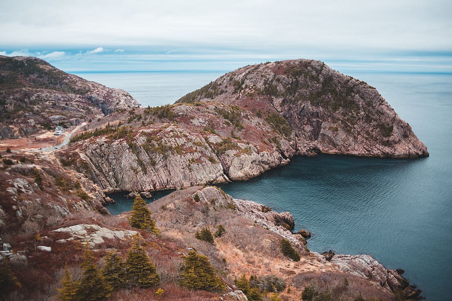 brown rock mountain, nature, land, outdoors, water, shoreline HD wallpaper
