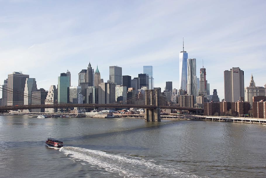 A boat passes under Brooklyn bridge in New York, america, architecture HD wallpaper