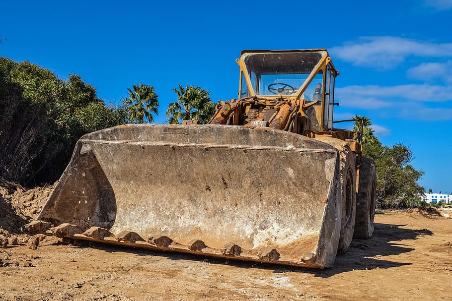 bulldozer, heavy machine, construction, bucket, sky, transportation HD wallpaper