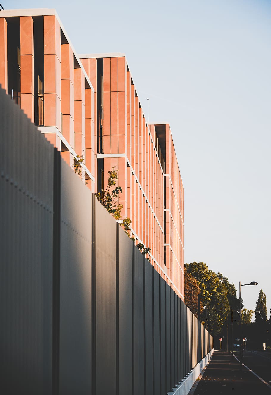 orange concrete building, architecture, city, street, fence, corrugated HD wallpaper