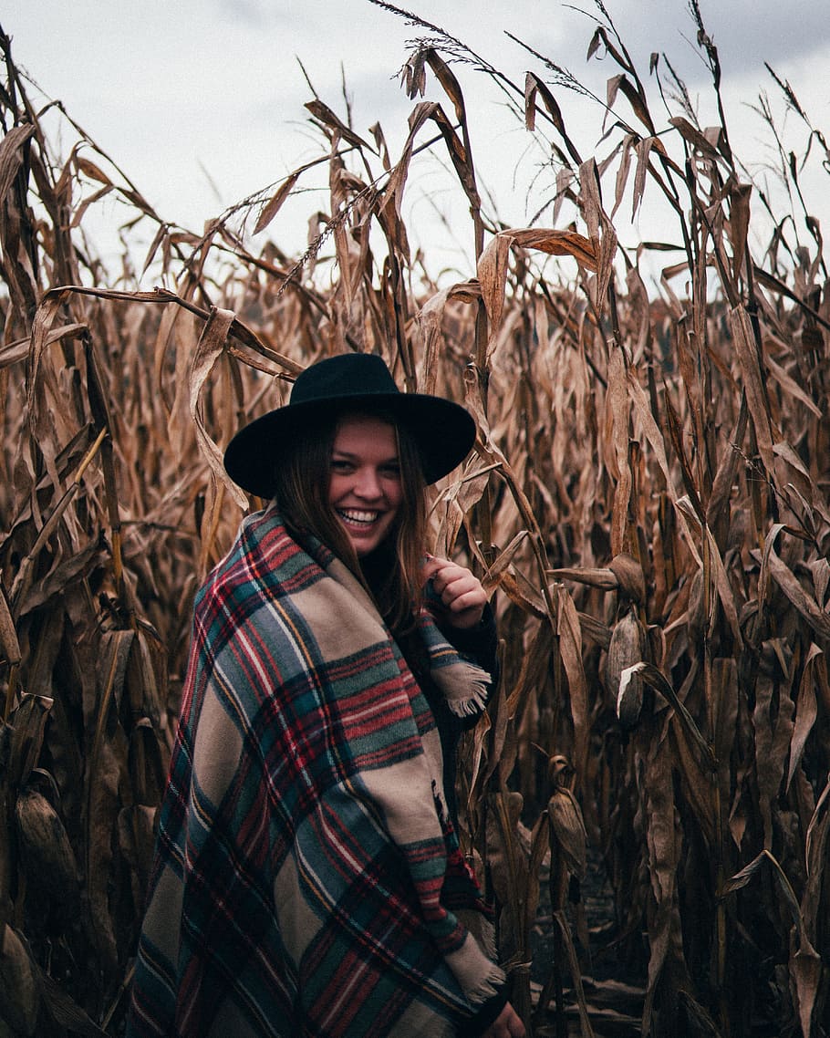 woman smiling in the middle of a wheat field, person, hat, corn HD wallpaper