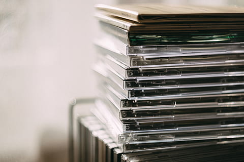 Pile of Assorted Cd Cases, blur, cds, data, education, facts HD wallpaper