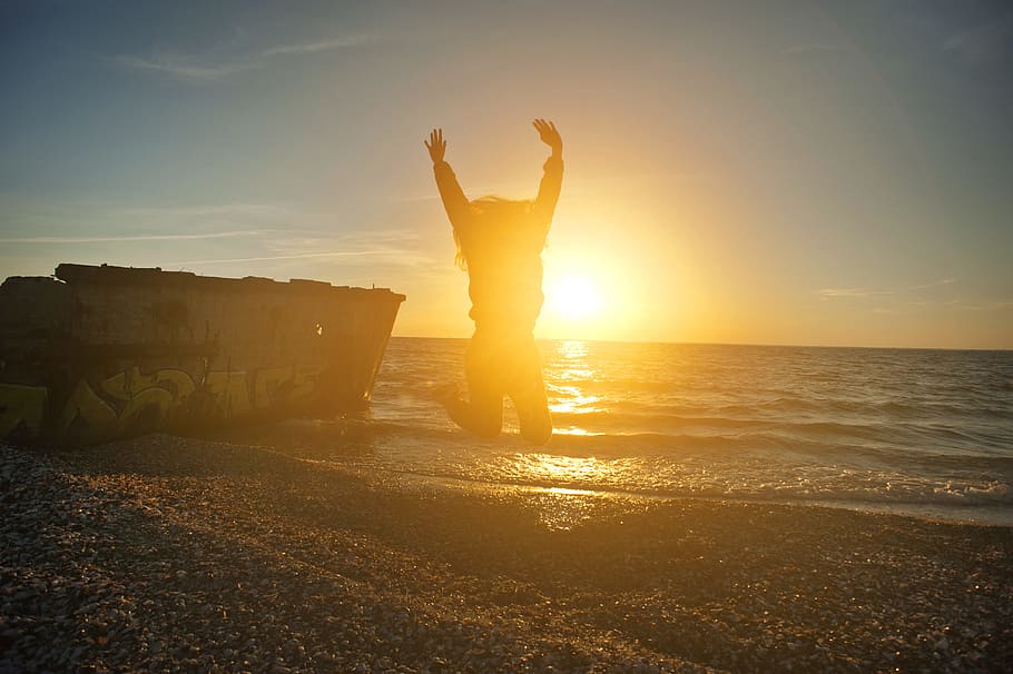 Person Jumping on Seashore during Golden Hour, beach, dawn, dusk HD wallpaper