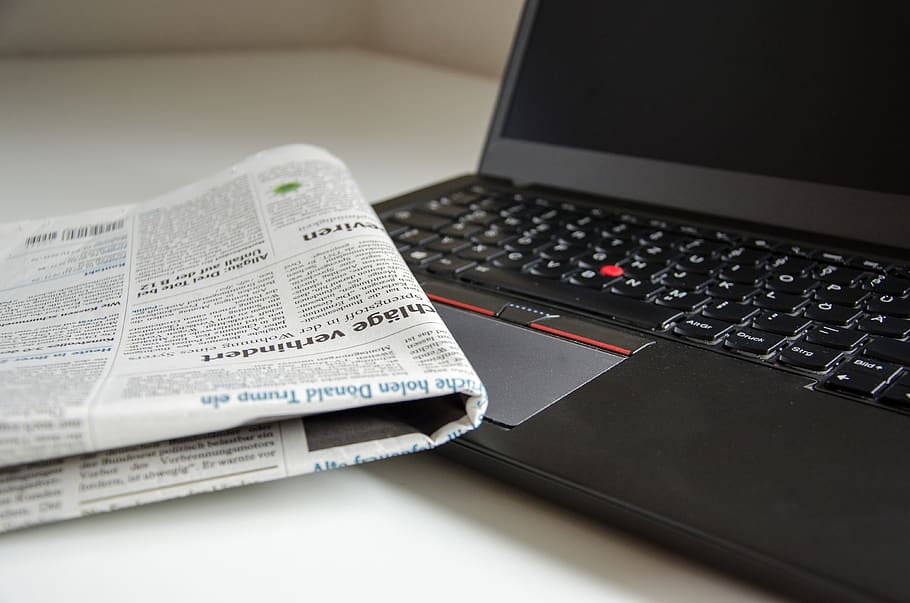 Newspaper on Black Lenovo Thinkpad, desk, finance, information HD wallpaper