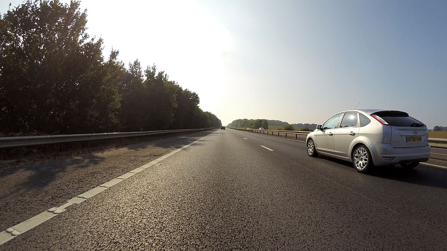 Silver Ford Focus 5-door Hatchback Speeding on Road, action, asphalt HD wallpaper
