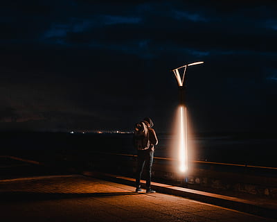 person, human, light, flare, lighting, tarmac, asphalt, apparel HD wallpaper