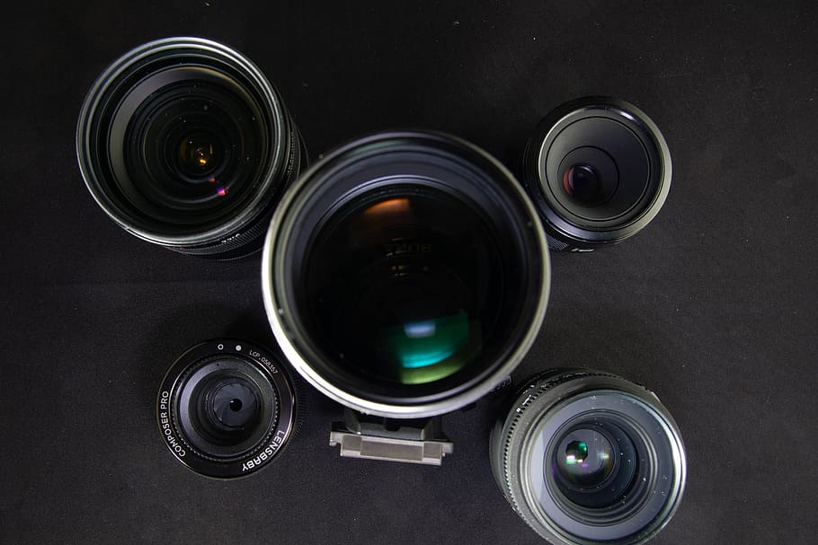 camera lenses on black surface, photography themes, lens - optical instrument HD wallpaper