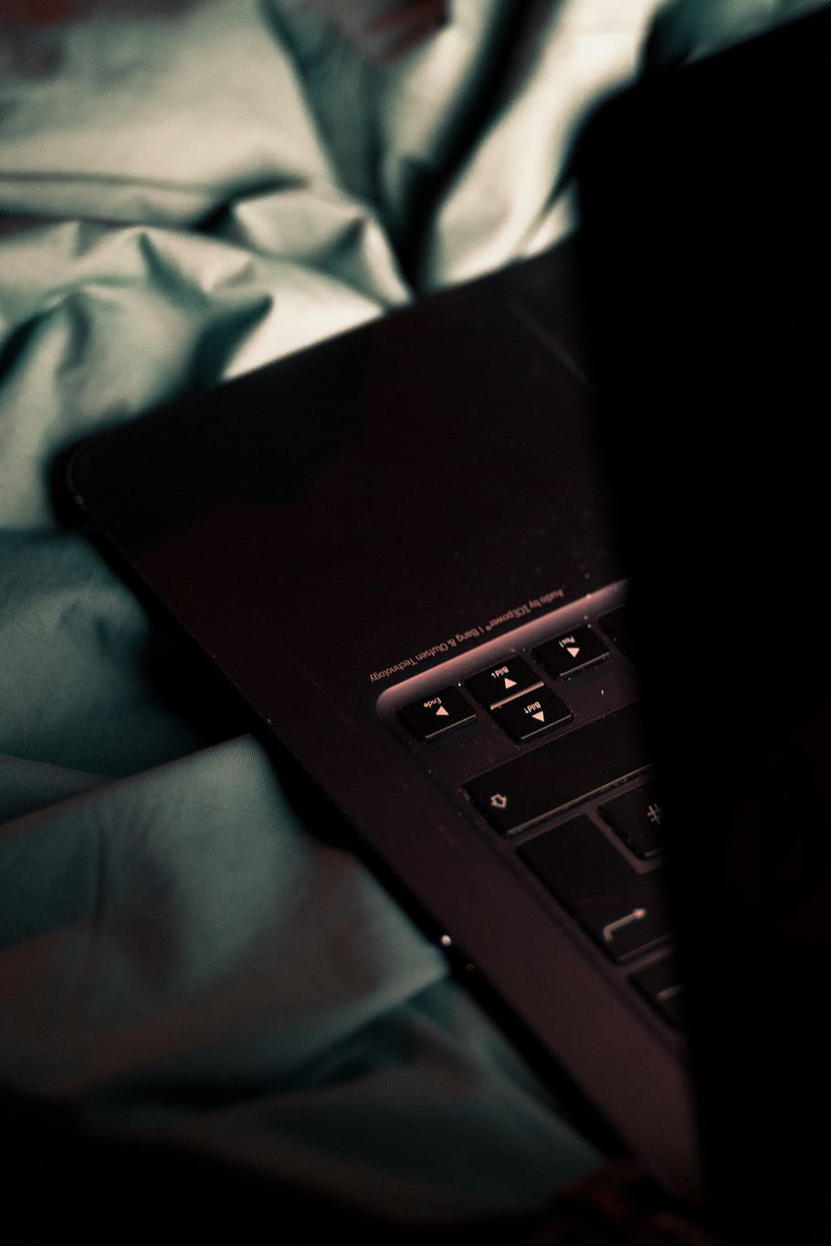 black laptop computer on gray textile, technology, wireless technology HD wallpaper