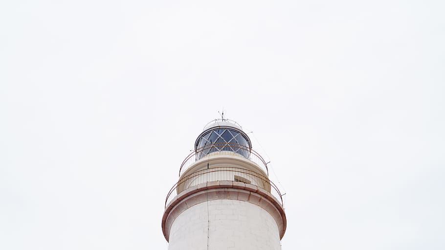 low-angle photography of white lighthouse under white clouds HD wallpaper