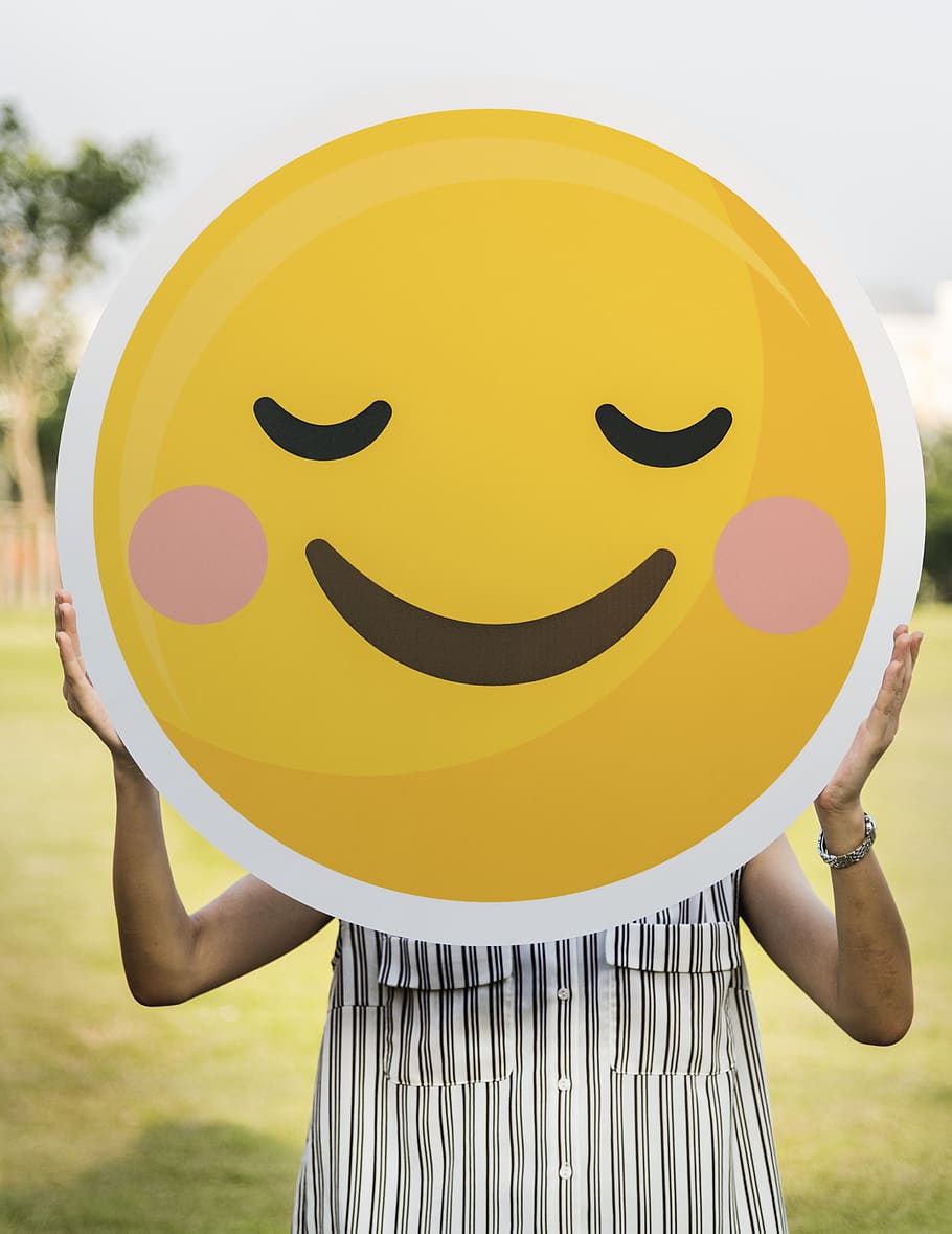 Person Holding Round Smiling Emoji Board Photo, carrying, casual