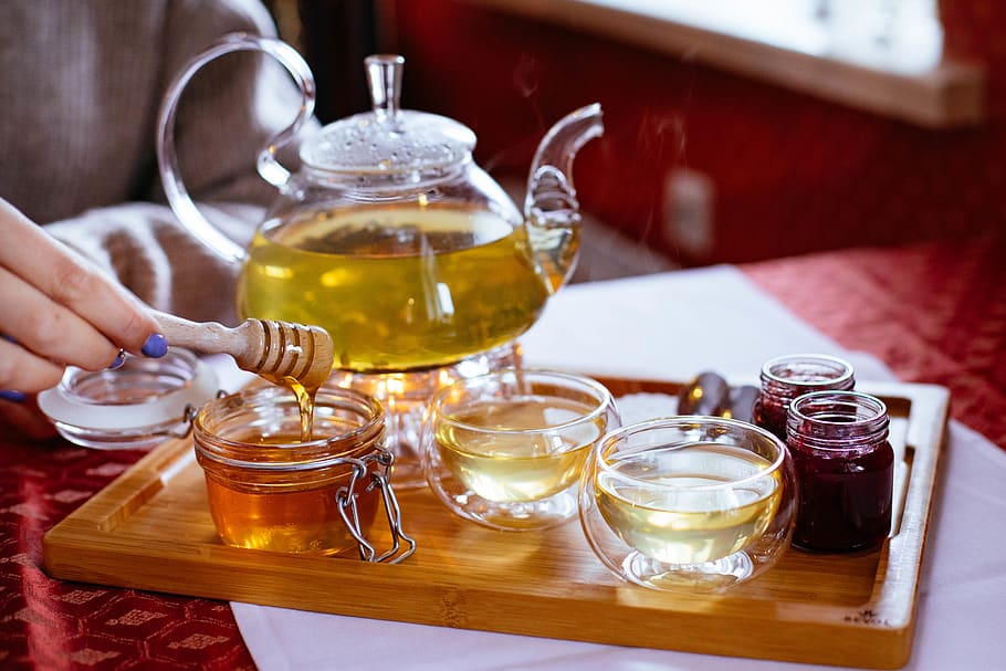 Person Holding Honey Stick With Teapot, beverage, container, cup HD wallpaper