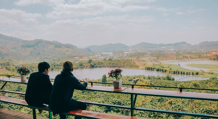 Two Person Sitting on Chair in Front of Lake and Mountains, bench HD wallpaper