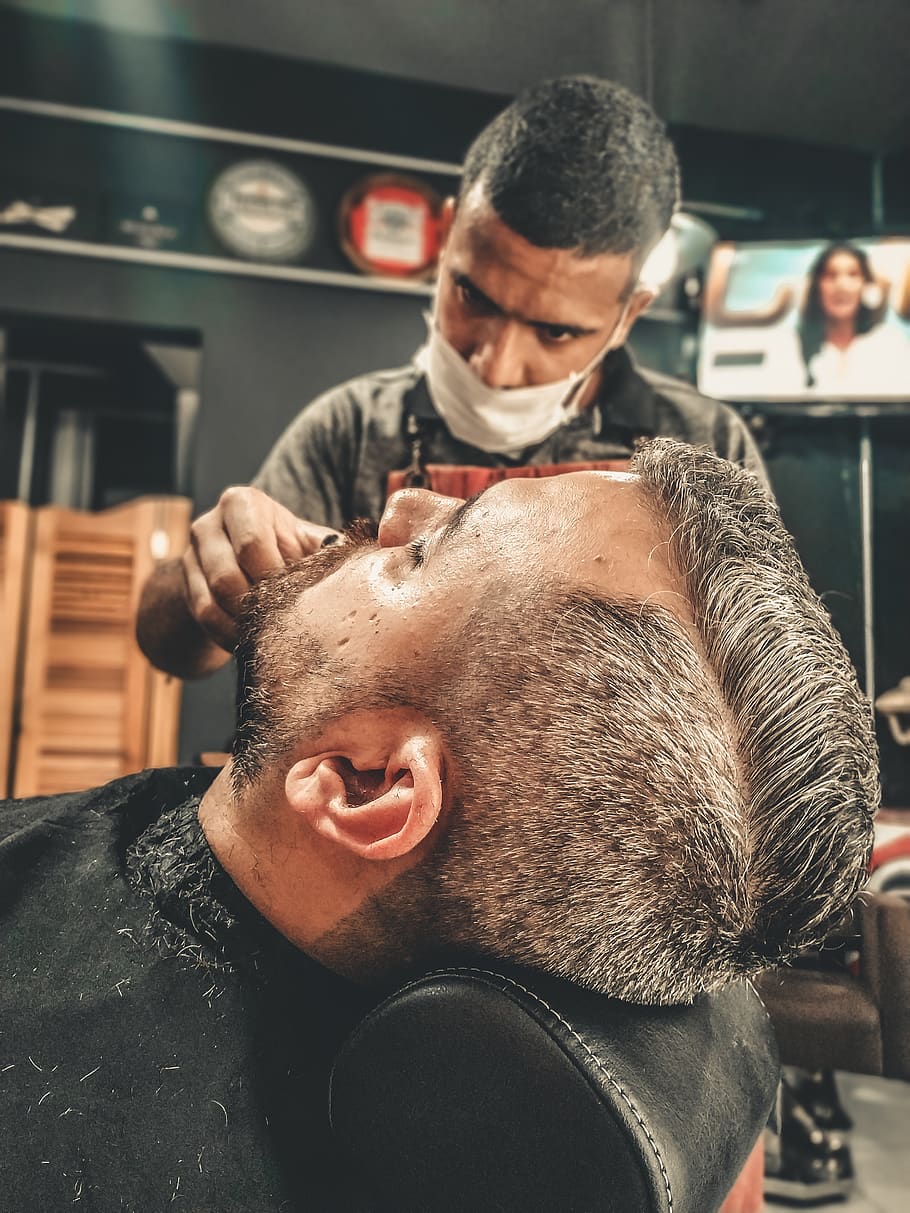 Stylish man sitting in a barbershop - Stock Image - Everypixel