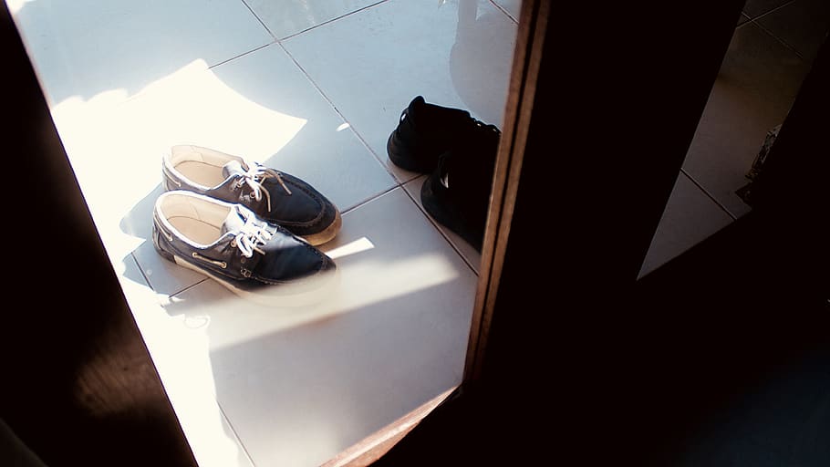 black dock shoes on white floor tiles, clothing, apparel, footwear
