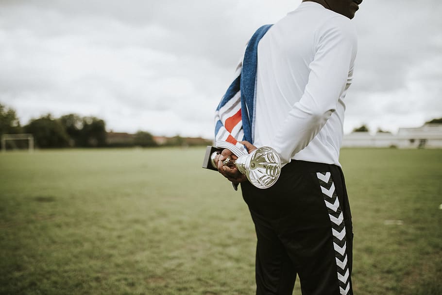 Man Holding Silver Trophy, award, competitive, field, honor, prize HD wallpaper