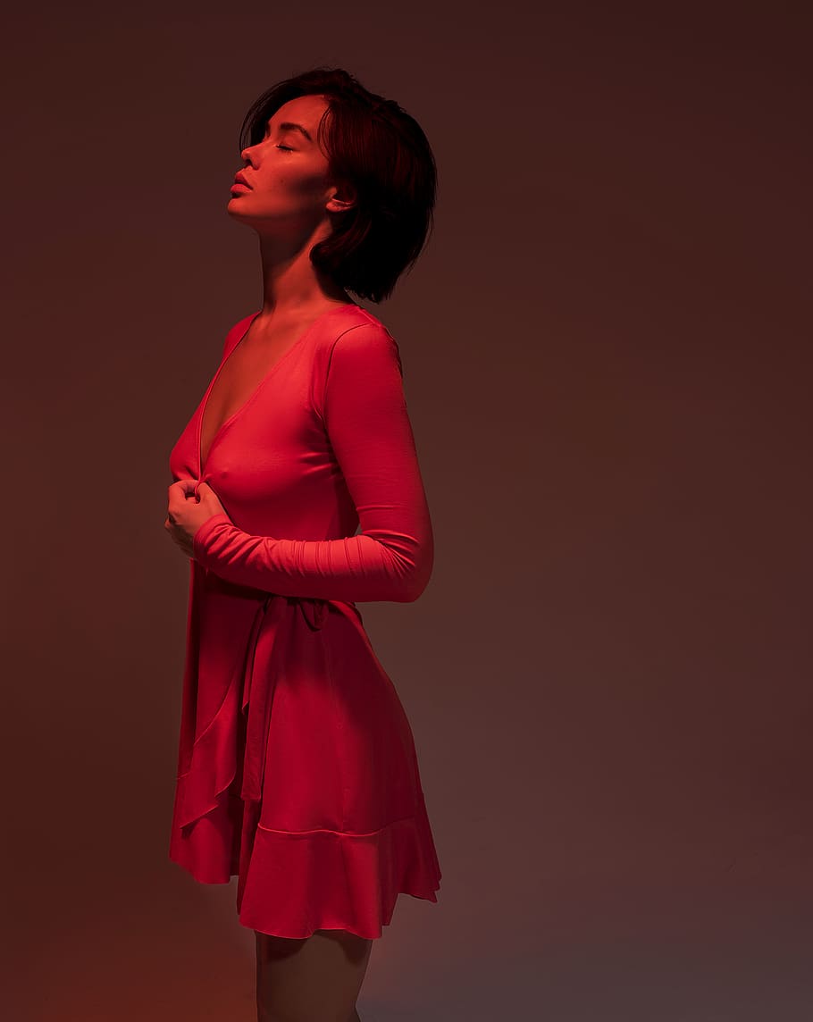 standing woman in pink long-sleeved dress, clothing, apparel