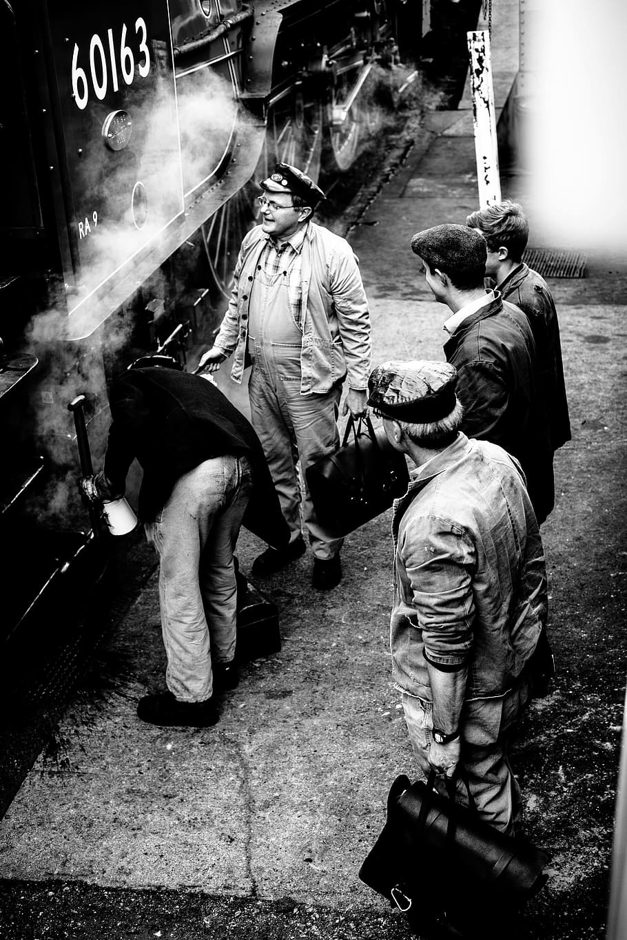 grayscale photo of men standing beside 60163 train, person, steam HD wallpaper