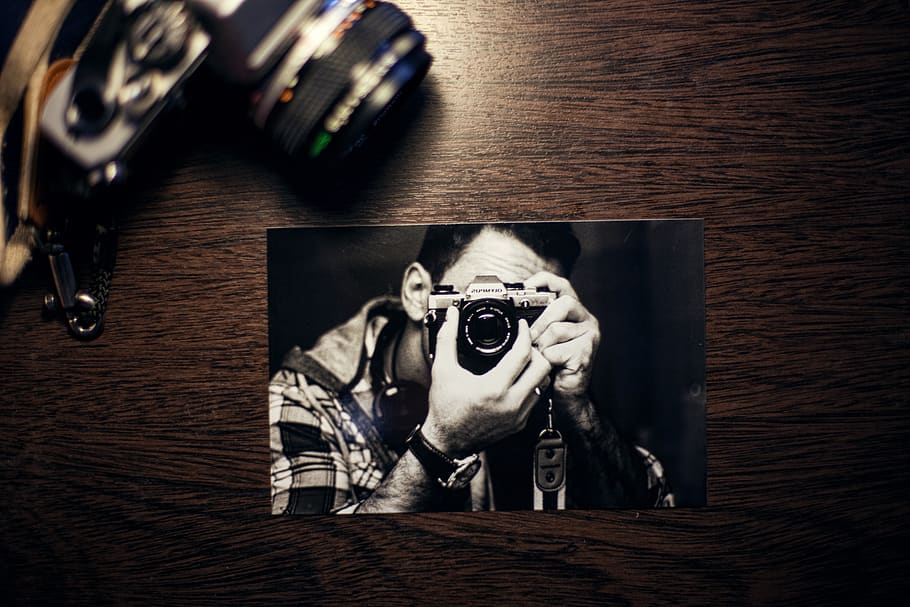 Person Using Camera Photo on Brown Surface, analog camera, image HD wallpaper